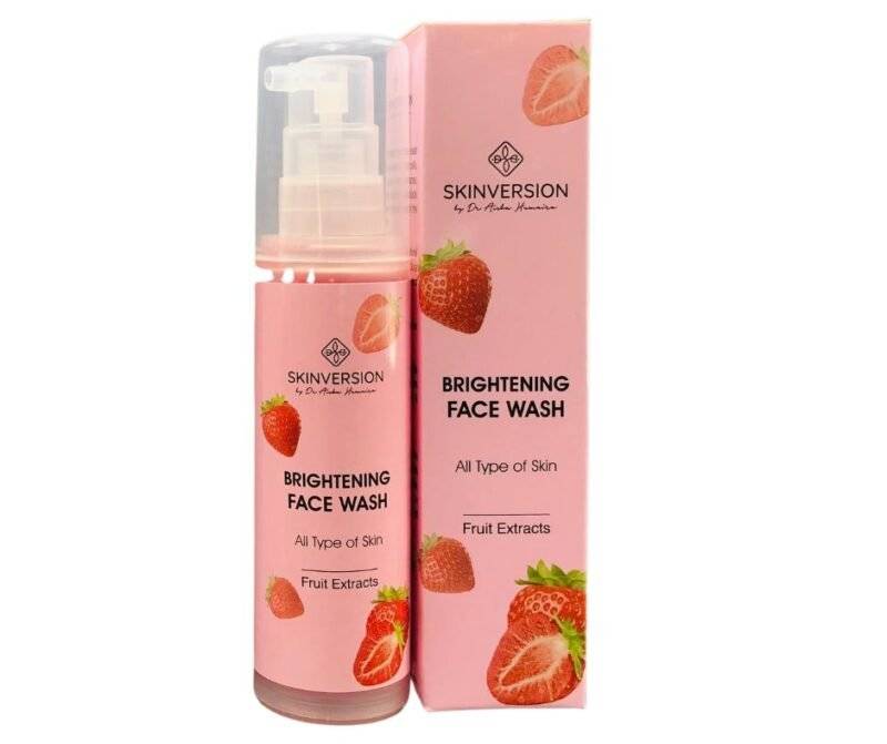 Tube of skin-brightening face wash with citrus extracts and vitamin C, placed on a clean white background with water droplets for a fresh and radiant look
